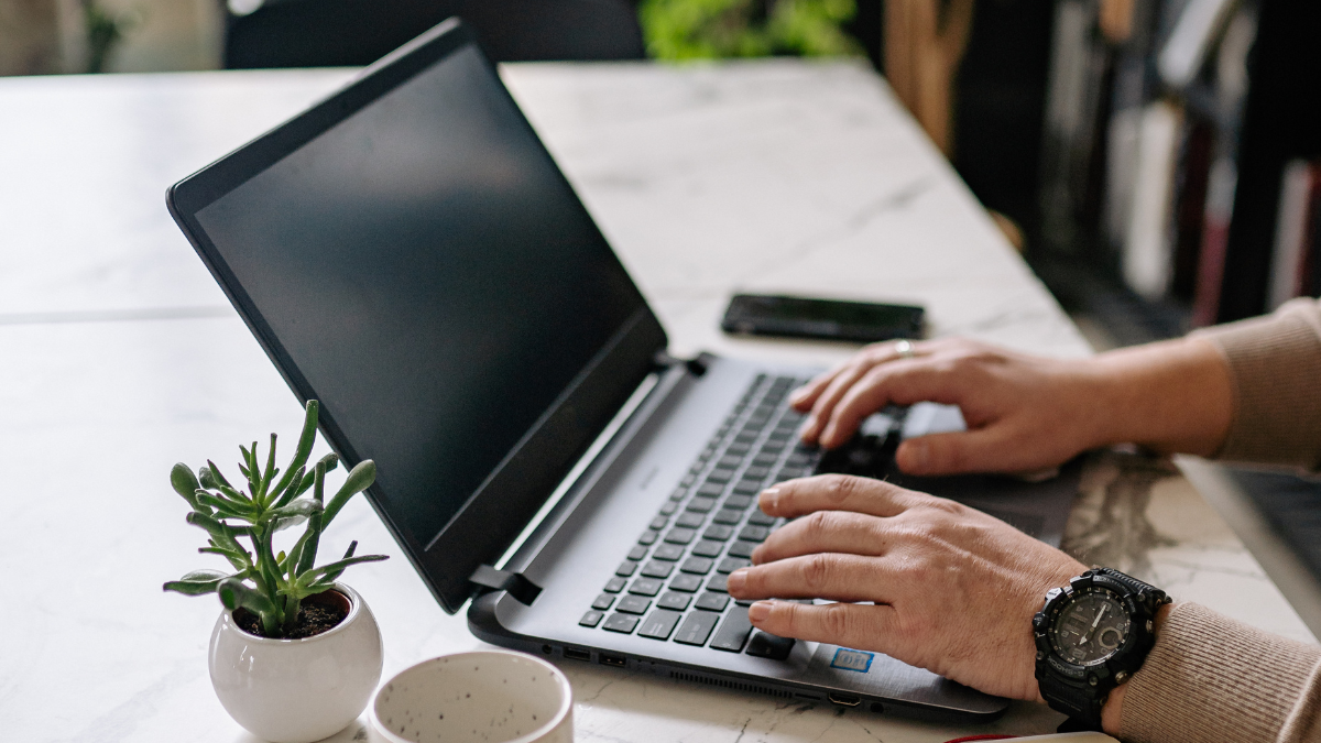 Monochrome workspace with clean lines and code on screen